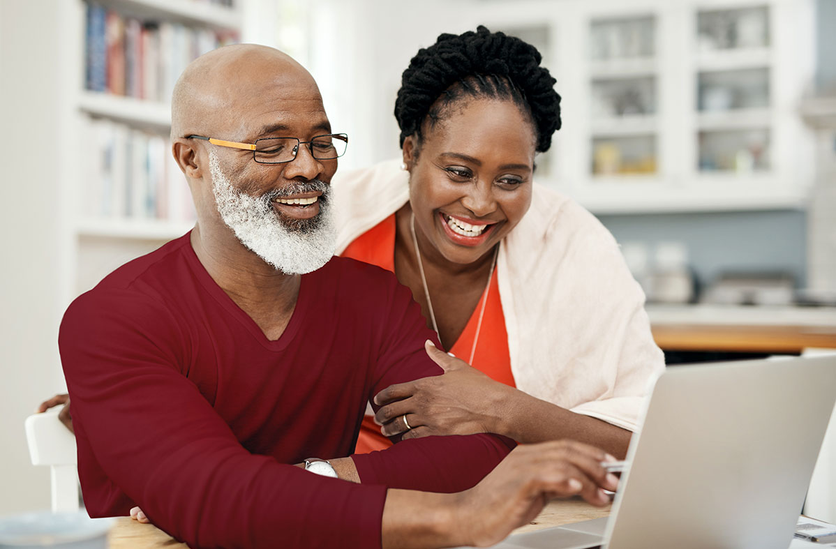 african american couple working on their laptop